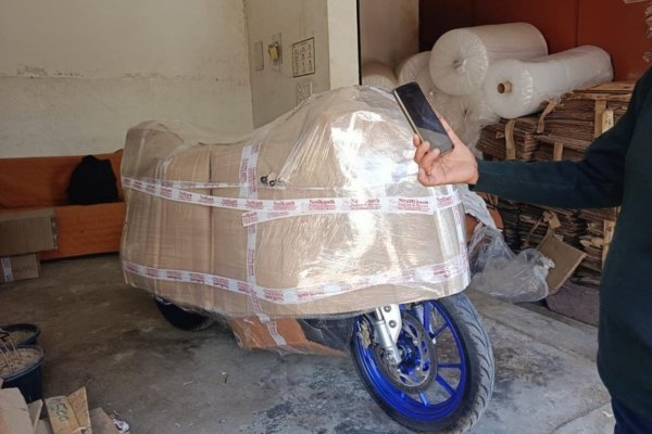 Vehicle being loaded onto transport Vehiclerier with safety equipment
